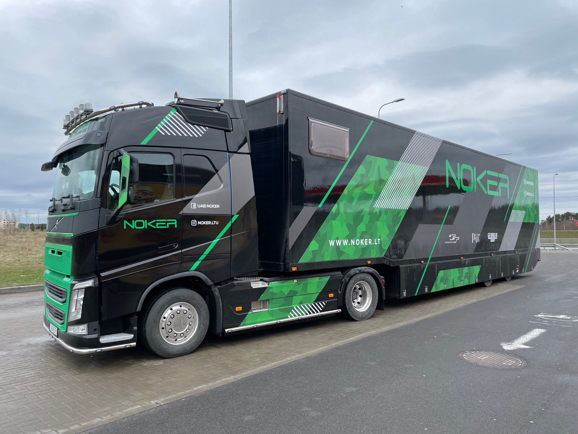 NOKER truck with green-livery trailer